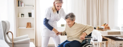 A,Health,Visitor,Helping,A,Senior,Woman,To,Stand,Up