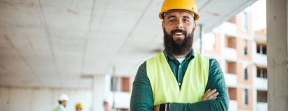 A,Smiling,Male,Construction,Worker,In,A,Yellow,Hard,Hat