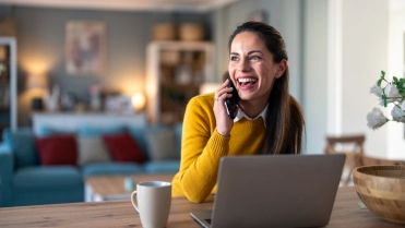 Happy,Positive,Woman,Entrepreneur,Sitting,In,Home,Office,,Working,On